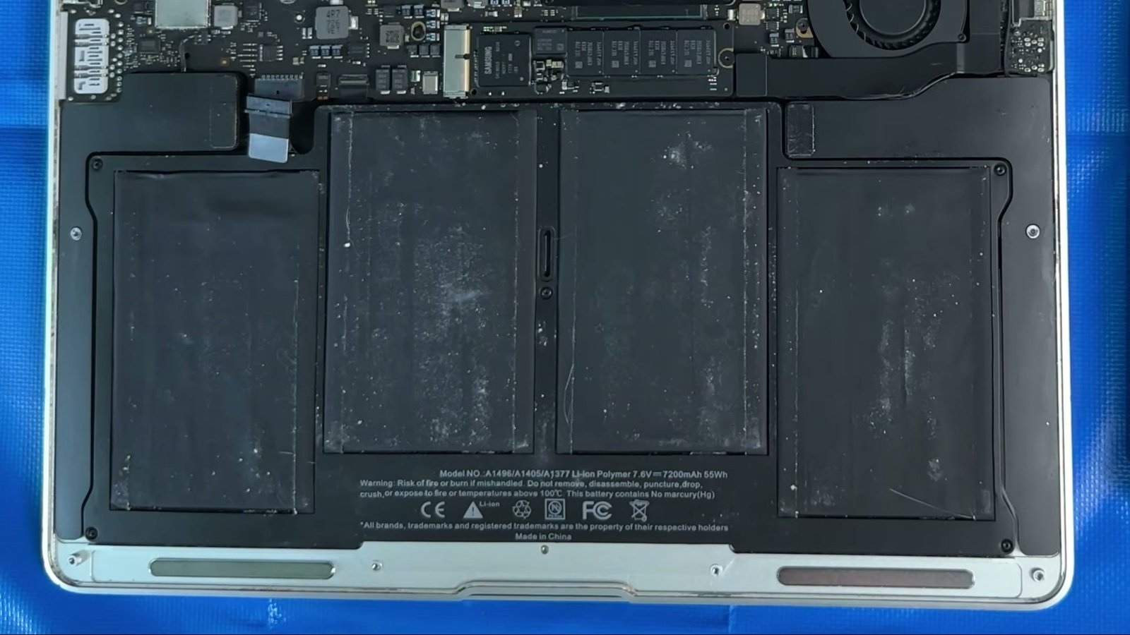 The 2017 MacBook Air battery connector pulled straight out, parallel to the logic board.