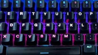 Backlit keyboard close-up representing accurate touch typing technique