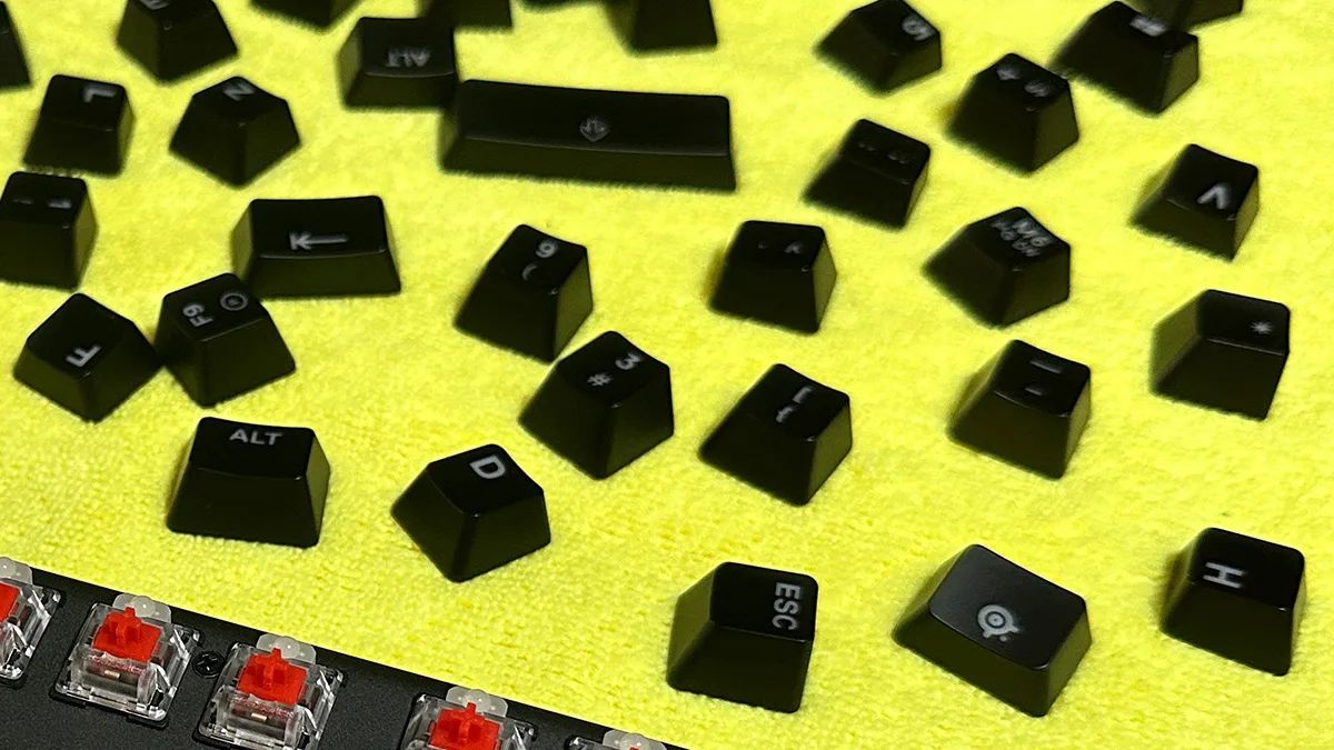 Keycaps laid out on a towel to air dry after washing and rinsing